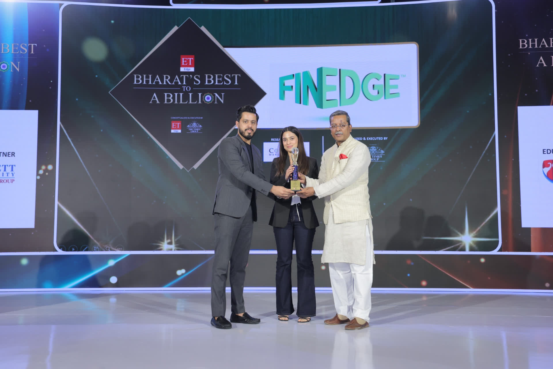 FinEdge receiving the Bharat's Best to a Billion recognition on stage, with ET Edge Bharat's Best to a Billion and FinEdge branding behind.