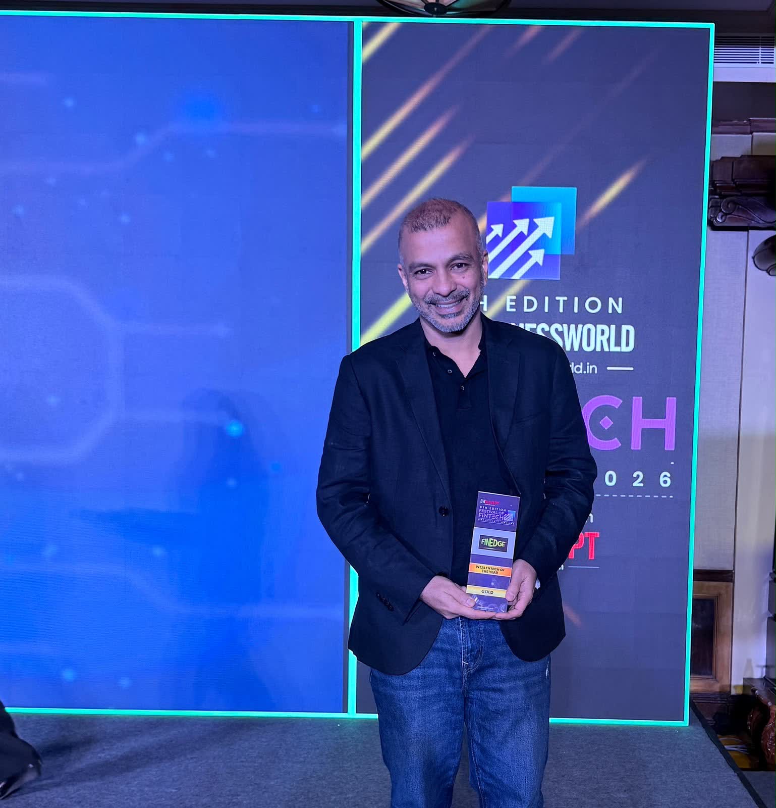 Mayank Bhatnagar, Co-Founder and COO of FinEdge, with the WealthTech of the Year Gold trophy at the 6th Edition BW Festival of FinTech 2026 in Bengaluru.