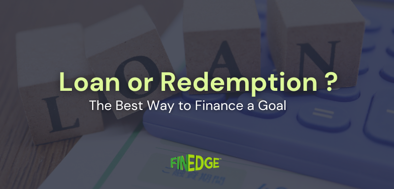 Wooden blocks spelling “LOAN” placed beside a calculator, representing the decision between taking a loan or redeeming investments to finance a financial goal, with FinEdge branding.