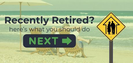Illustration of a road sign with elderly couple symbol and bold text 'Just Retired? Here's what you should do next'—a retirement planning guide from FinEdge to help new retirees navigate their financial future.