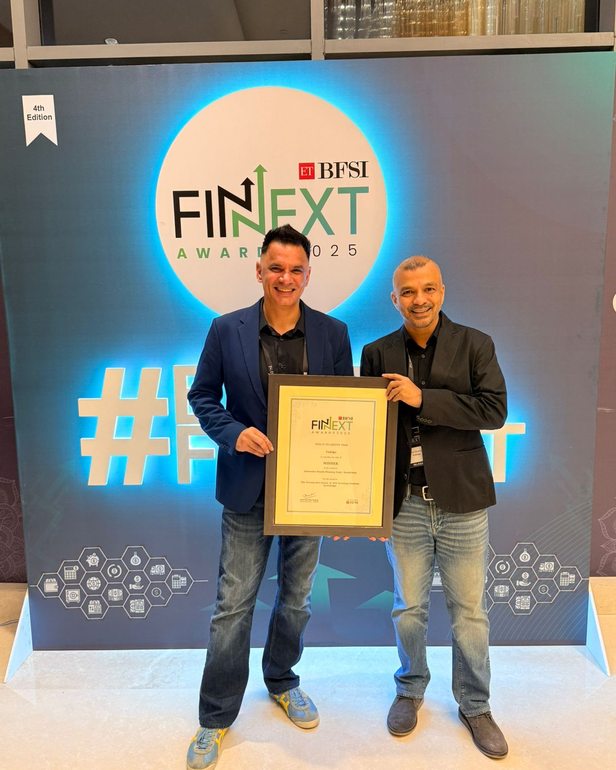 FinEdge team receiving the ET BFSI FinNext 2025 Award for Innovative Wealth Planning Tools for their proprietary platform, Dreams into Action (DiA).